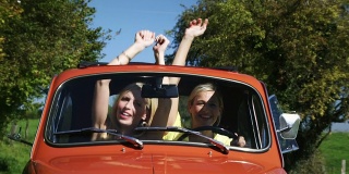 Two girls driving car