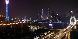 广州现代都市夜间过桥交通繁忙，时光流逝。