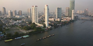View from hi-rise deck across city skyline, Chao Phraya River