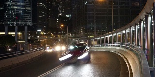 时间推移，香港夜间多车道公路及楼宇的繁忙交通。