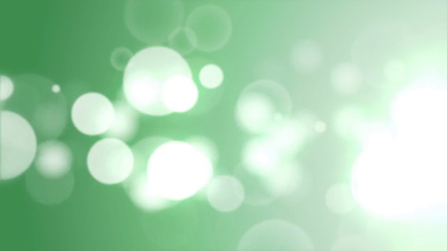 移动粒子环-抽象绿色散焦光背景