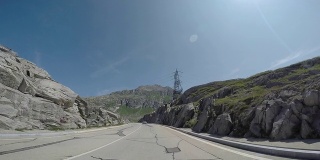 Car driving on high mountain pass POV