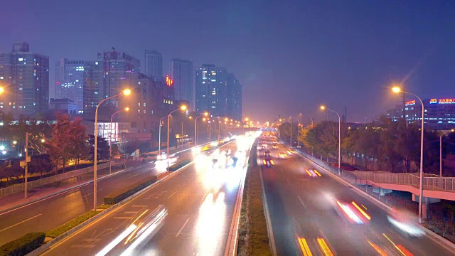 traffic on city road and modern building at night in beijing 4k