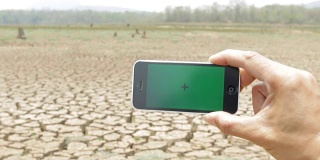 Green screen phone, arid climate.