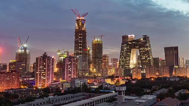 T/L MS HA PAN View of Beijing Skyline and Construction Site, Day to Night Transition /北京，中国