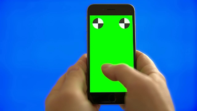 Smartphone male hand texting surfing chromakey blue screen