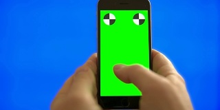 Smartphone male hand texting surfing chromakey blue screen