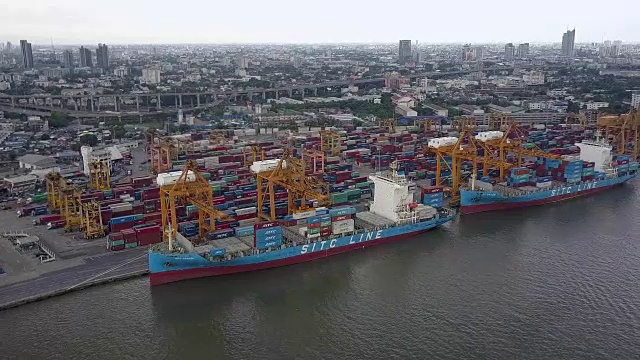 Aerial shoot of Containers at Bangkok commercial port along Jao Phra Ya River, Bangkok, Thailand.
