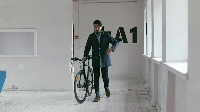 Japanese Graphic Designer coming to work with bike (slow motion)