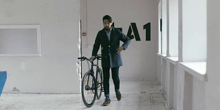 Japanese Graphic Designer coming to work with bike (slow motion)