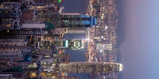 4K T/L垂直香港城市白天到晚上的景观