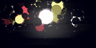 黑色背景上的彩色发光球。数字动画3d渲染。4K，超高清分辨率