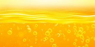 金色的波浪和天空。带有氧气气泡的金色液体。这可以用于广告和项目，娱乐，阳光，燃料，油，蜂蜜，啤酒，果汁