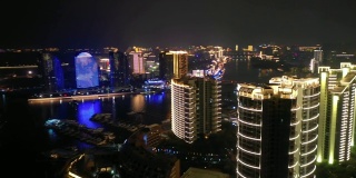 夜光照亮三亚湾滨江公寓综合楼航拍4k海南岛中国