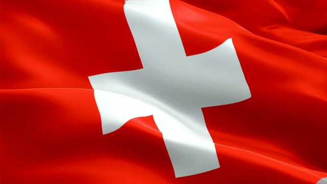 瑞士国旗特写1080p全高清1920X1080镜头视频在风中飘扬。瑞士国旗飘扬。瑞士标志无缝循环动画。瑞士国旗高清分辨率背景1080p