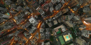 sunset night illuminated hong kong city traffic streets wan chai district aerial topdown panorama 4k