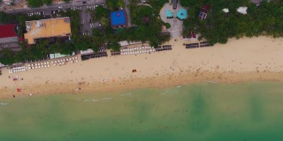 白天三亚著名的大东海拥挤的海滩空中全景4k海南中国