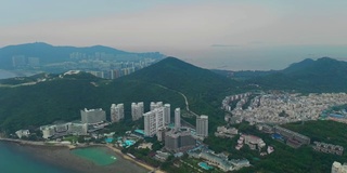 傍晚日落时间三亚市景观大东海镇湾航拍全景4k中国海南