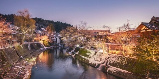 Village snow viewpoint sunset twilight at Takayama city and stream water, Japan Time lapse