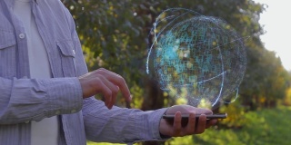 Man shows hologram with text Data Warehousing