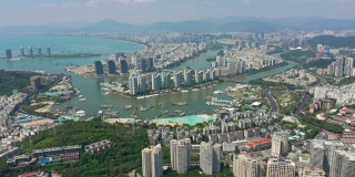 阳光明媚的三亚著名的城市景观岛航拍全景4k海南中国