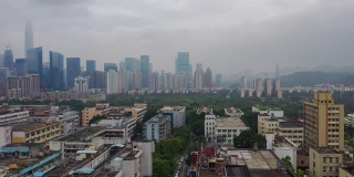 白天飞行在深圳城市景观市中心空中全景4k中国