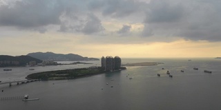 日落天空三亚湾著名的豪华酒店度假岛航拍全景4k海南中国