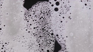泡沫气泡抽象的黑色背景视频素材模板下载