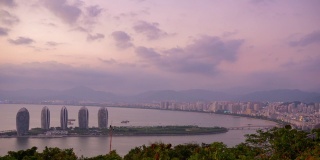 三亚市海湾日落著名的公园，山顶酒店度假岛全景4k时间，中国海南
