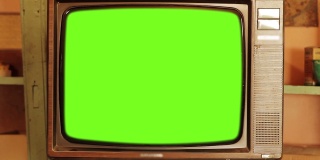 80年代的绿色屏幕电视。红色基调。缩小。