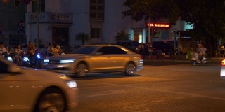 三亚城市中心夜间时间照明交通街道全景4k中国海南