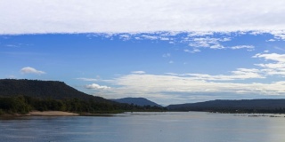 Mae khong" river with mountain background under cloudy sky"