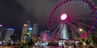 4K超高清时光流逝:香港中区的摩天轮和都市现代景观背景。