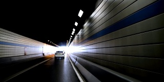 Car leaving in tunnel