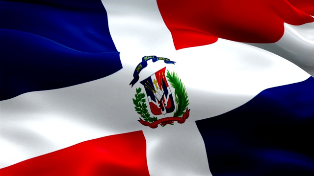 多米尼加共和国的旗帜在风中飘扬。现实的多米尼加共和国国旗背景。多米尼加共和国旗帜循环特写1080p全高清1920X1080镜头。多米尼加共和国南美国家国旗镜头视频电影，新闻