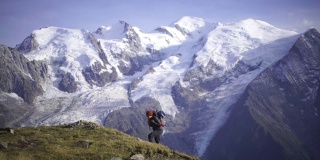 Hiker walking along a path near Mont Blanc