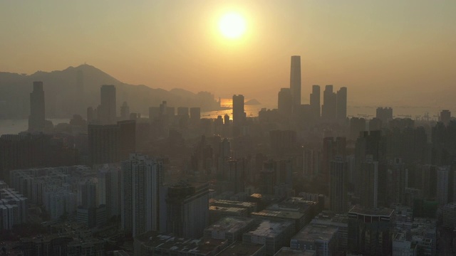 Aerial view of Kowloon and Hong Kong Island in sunset