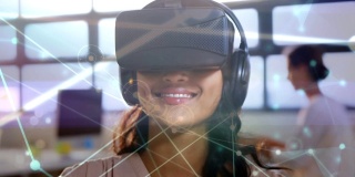 戴着虚拟现实耳机在办公室里打字的女人