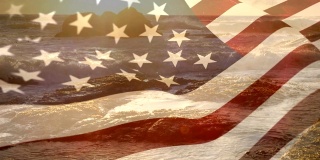 在海滩的背景下飘扬的美国国旗