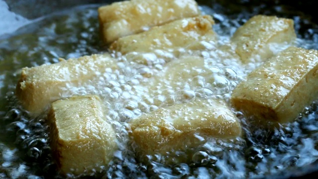Frying tofu in pan
