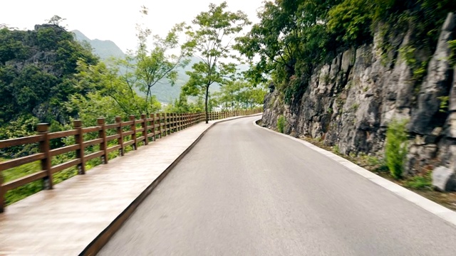 View of Car drive on mountain road,Guizhou,China.