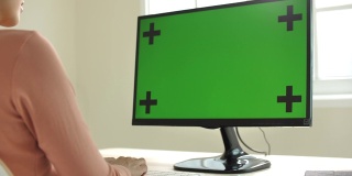 Woman Works on Her Chroma key Computer in a Home