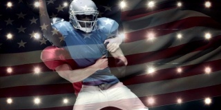 橄榄球运动员被挡在前面的一面美国国旗下