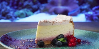 Cheesecake with berries on plate.