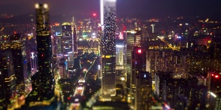 夜间时间照亮广州市中心城市景观空中倾斜漂移全景4k时间间隔中国