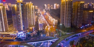 夜光青岛市中心交通街道路口航拍时间全景4k中国