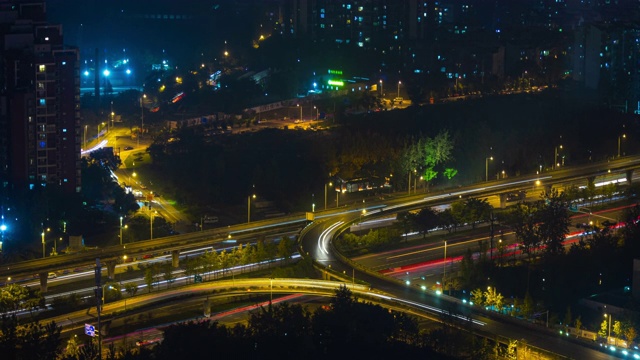 夜景时间照亮成都城市交通街道道路屋顶延时全景4k中国