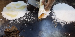 Preparing a tapioca in a street market in Brazil