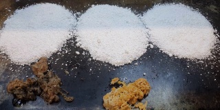 在巴西的街头市场上准备木薯粉
