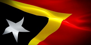 东帝汶旗运动循环视频在风中飘扬。东帝汶国旗的现实背景。东帝汶岛旗帜循环特写1080p全高清1920X1080镜头。东帝汶亚洲国家旗帜镜头录像电影，新闻